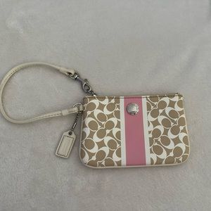 Small classy nude and light pink Coach wristlet